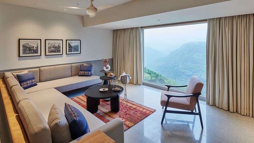 Image of a sitting area with a large window overlooking the valley at The Dukes Retreat.