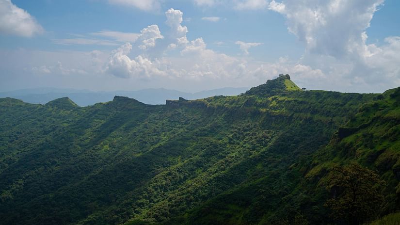 View of Sahyadri hill ranges with cloudy sky in the background.