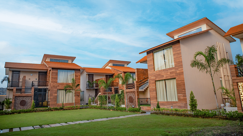 The facade of the villas set against the vivid blue sky - Wedlock Greens Hotel Resorts Dhanbad