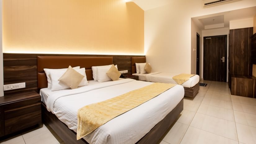 Picture showing the King size bed and the Single bed in the Super Deluxe Triple Suite, at ZARA’s Resort, Khandala