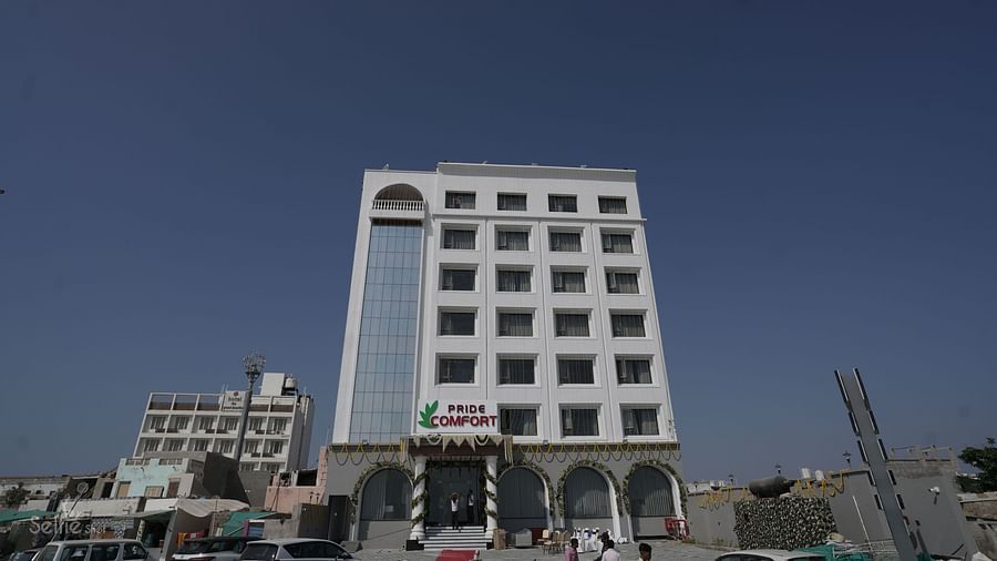 Facade of Pride Comfort, Dwarka on a clear blue day