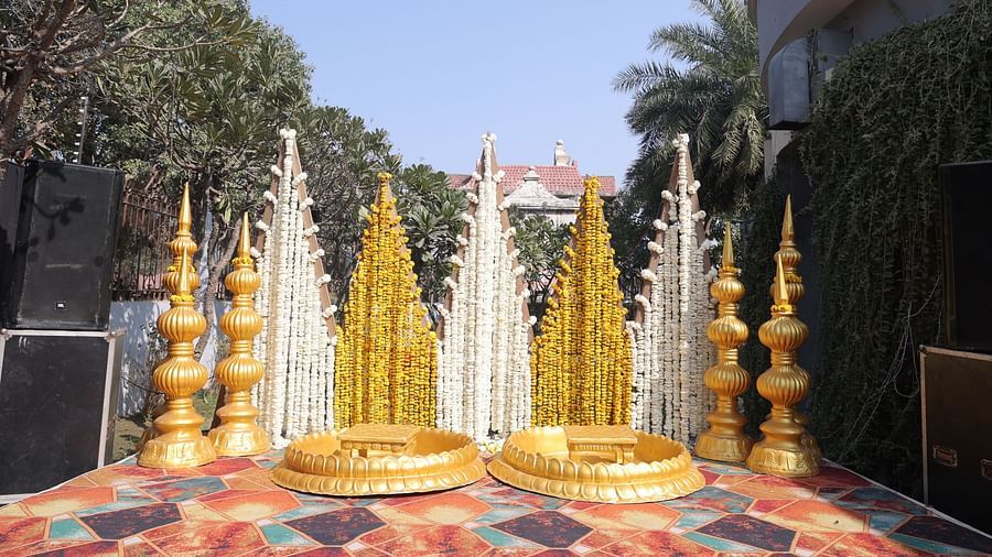 Traditional wedding stage decorated with golden and marigold accents at Shri Radha Brij Vasundhara Resort & Spa.