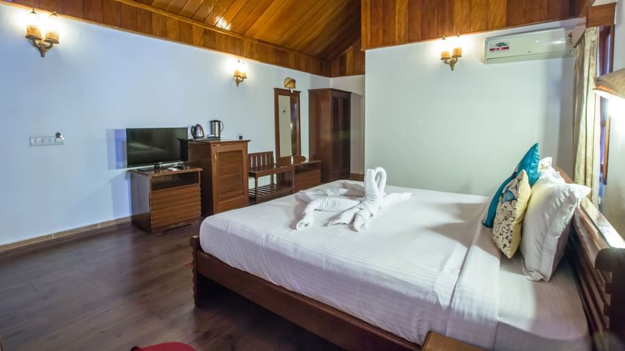 A bedroom with a pitched roof