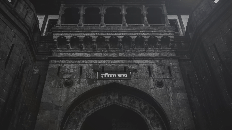 The imposing main entrance of Shaniwar Wada displaying the historic fort gateway.