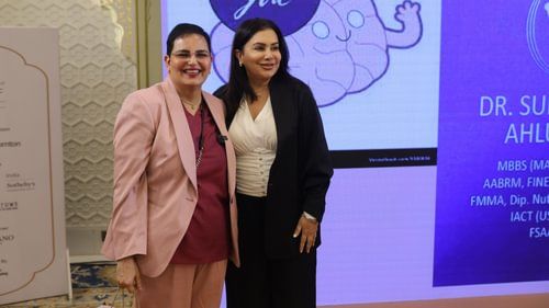 An image of two women posing for the camera at an event in Heritage Village Resorts & Spa 5190