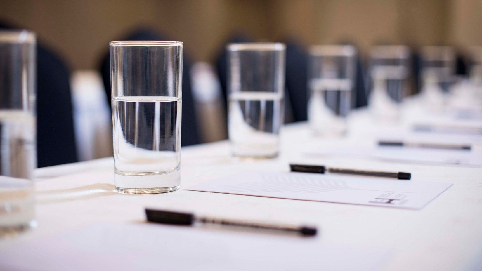 Glasses on a table in a meeting room - Hablis Hotel, Chennai