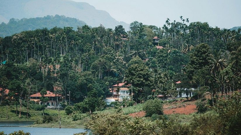 A far out view of kutta village with a mountain in the background
