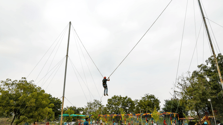 A person experiences an extreme bungee ejection ride high in the air - District Gravity Adventure Park, Hyderabad