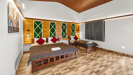 Family Room With Garden View 2 at Hatti Eden Coorg with one king size bed, one single bed, wooden interiors, decorative accent wall, and large garden-facing windows.