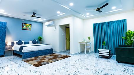 An image of a Suite with sitting area, a king size, AC, fan, etc. Hotel Aerotel, Hyderabad - A Unit of Comfort Hometel