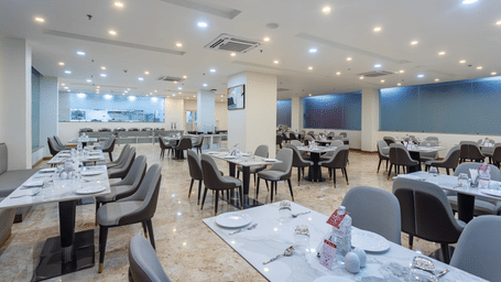 Close up view of dining tables placed spaciously at the Blue Coriander Restaurant at Mandala Norling Lords Prime in Kathmandu.