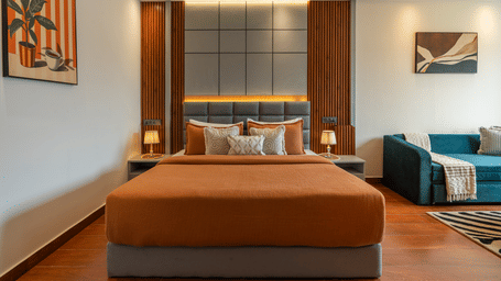 Well-appointed bedroom with king size bed and warm wooden interiors