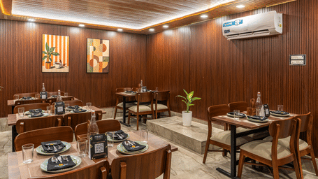 dining area with wooden interior and modern architecture.