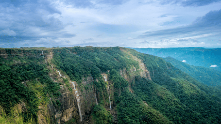 A  wide shot of scenic landscape of the Seven Sisters Falls.