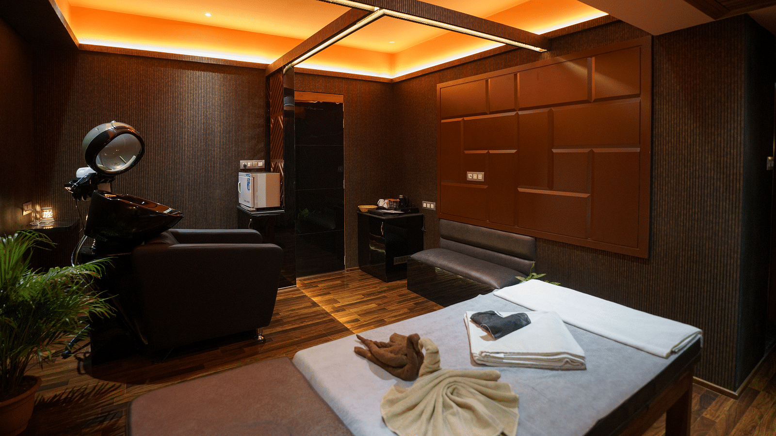 Image of a massage bed with towels on it and other equipment next to it at Coral Reef Hotel & Spa in Port Blair