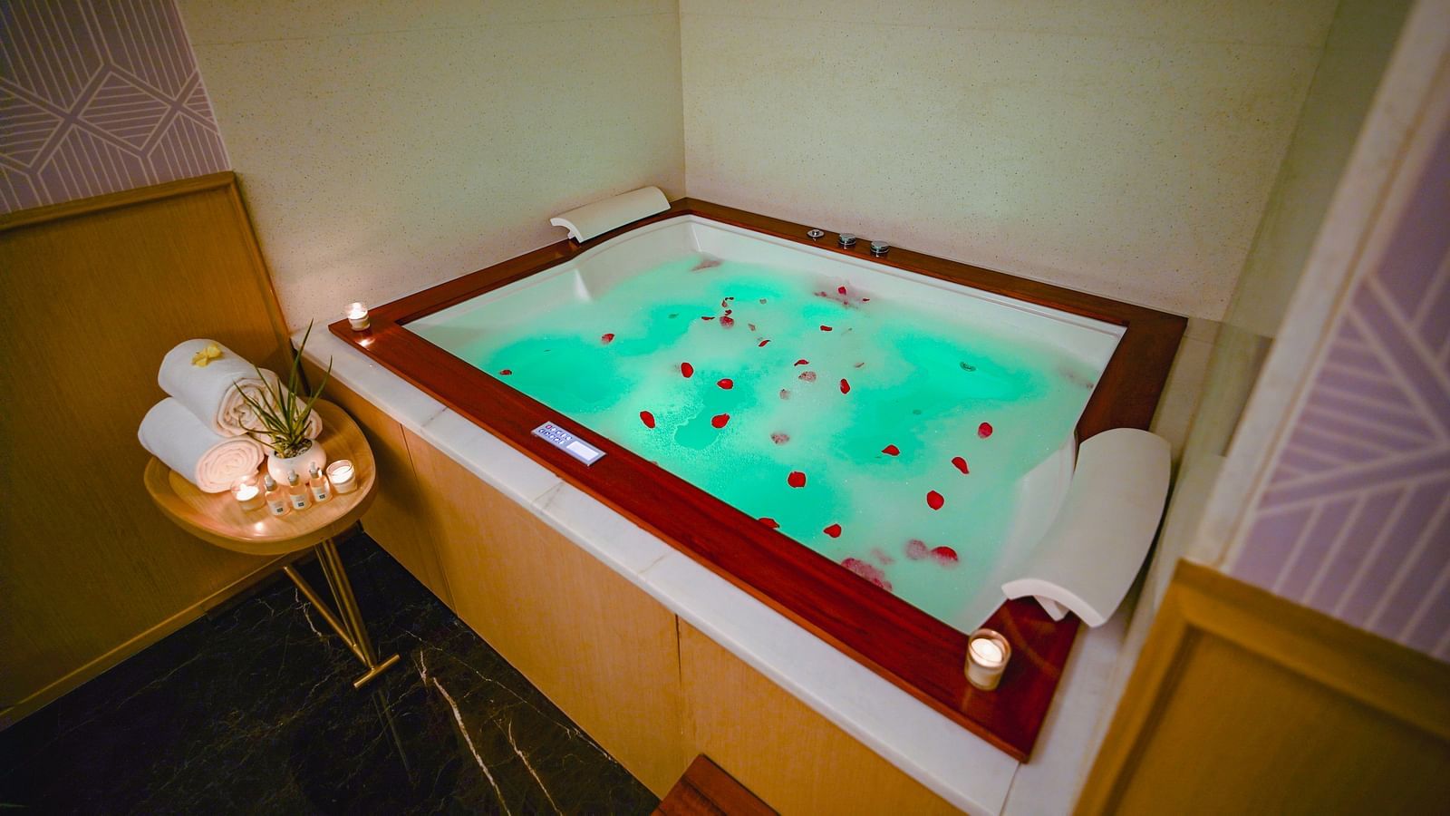 A jacuzzi in our Madhurai spa with flower petals in the water - Grand Madurai by GRT Hotels