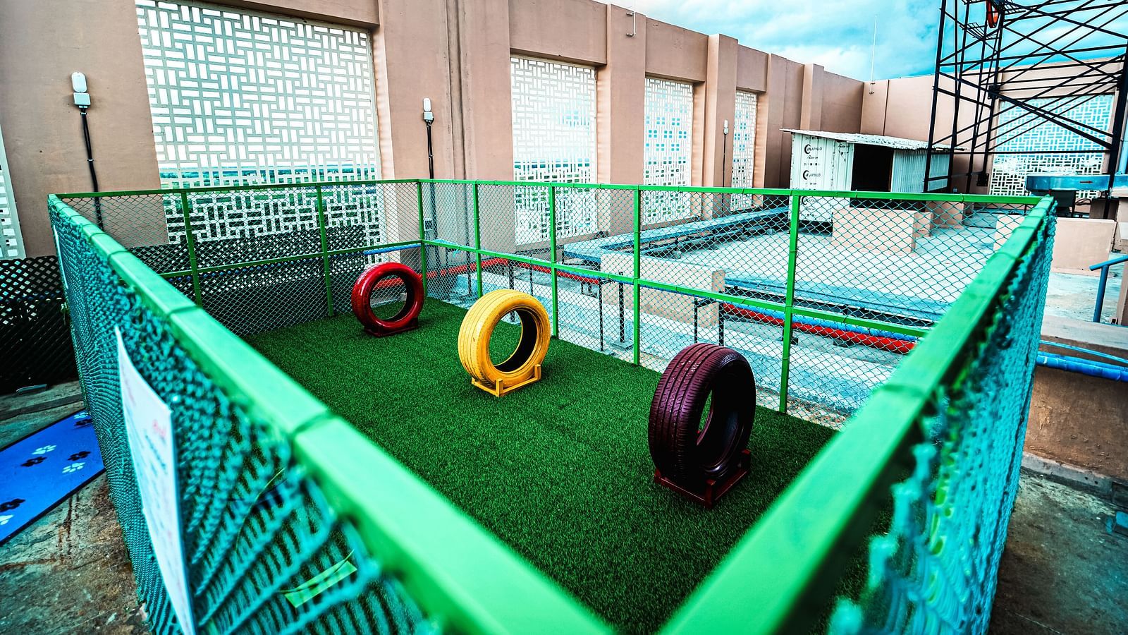 A view of the pet park at our Madurai hotel, equipped with playful toys and structures for animals - Grand Madurai by GRT Hotels