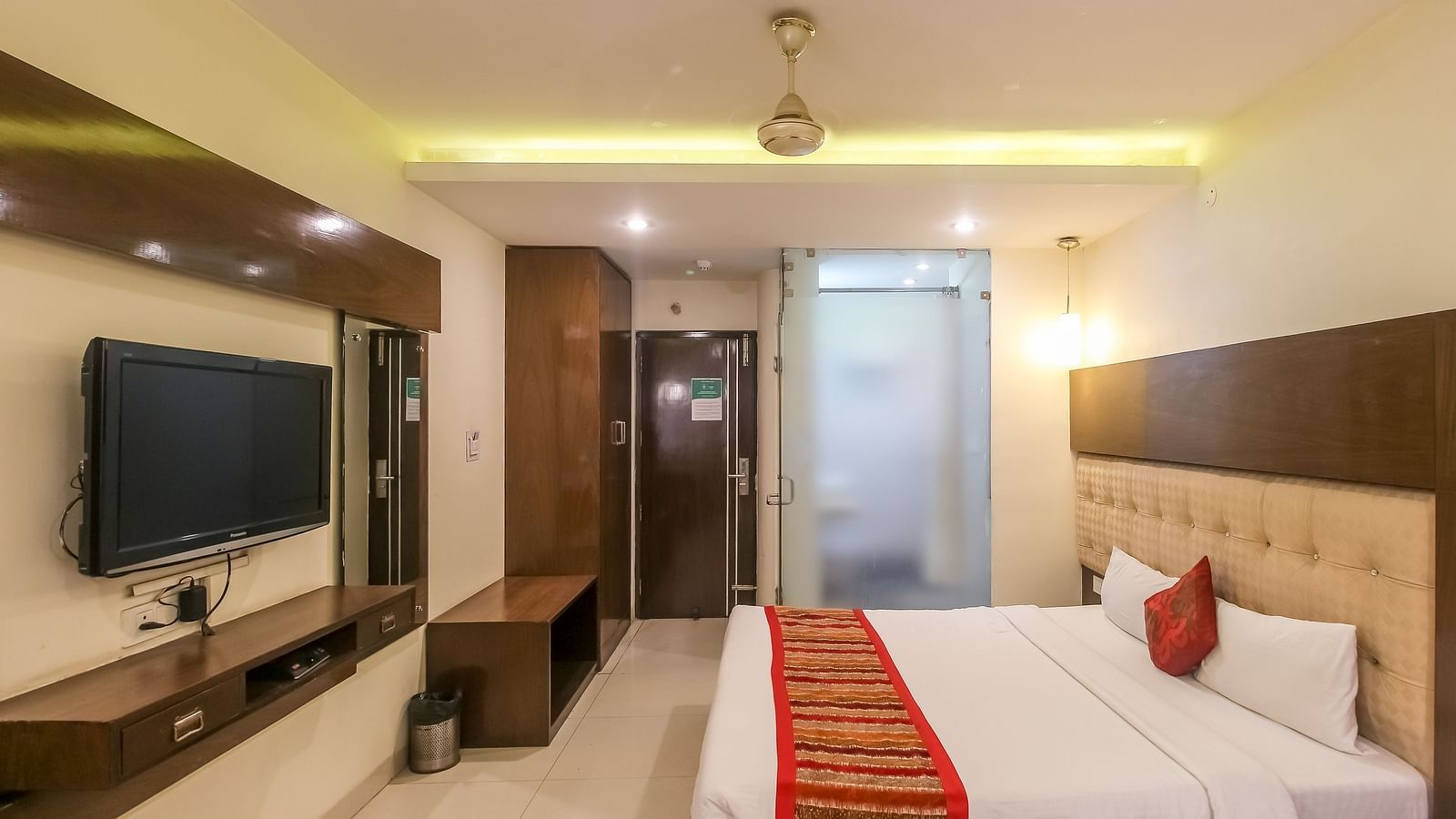 Club Room with stylish interiors, a soft headboard, and warm lighting - Hotel Diamond Plaza, Chandigarh.