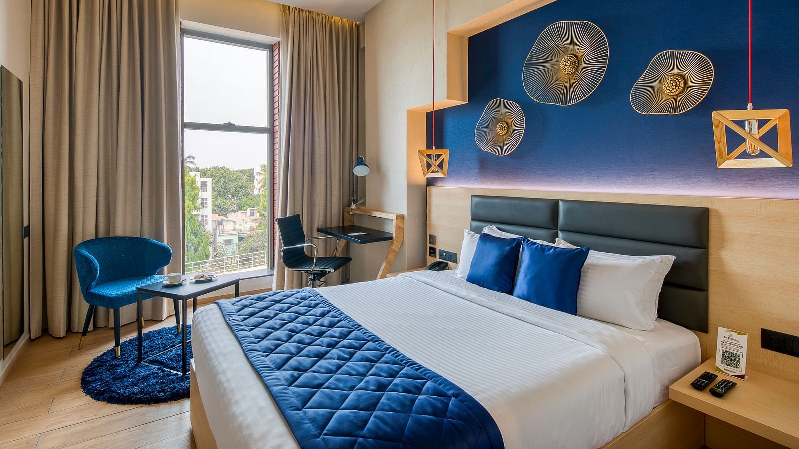 Side view of the double bed at the Premium Room at Le Foliage by TGI, Bangalore