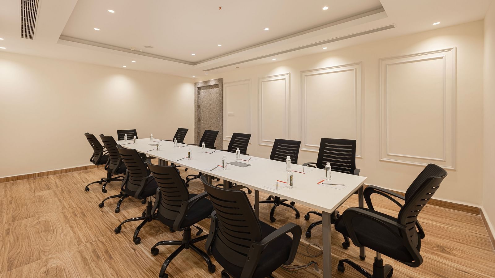 A corner view of the boardroom seating arrangement near the entrance at Lemonridge Hotels, IDPL Balanagar.