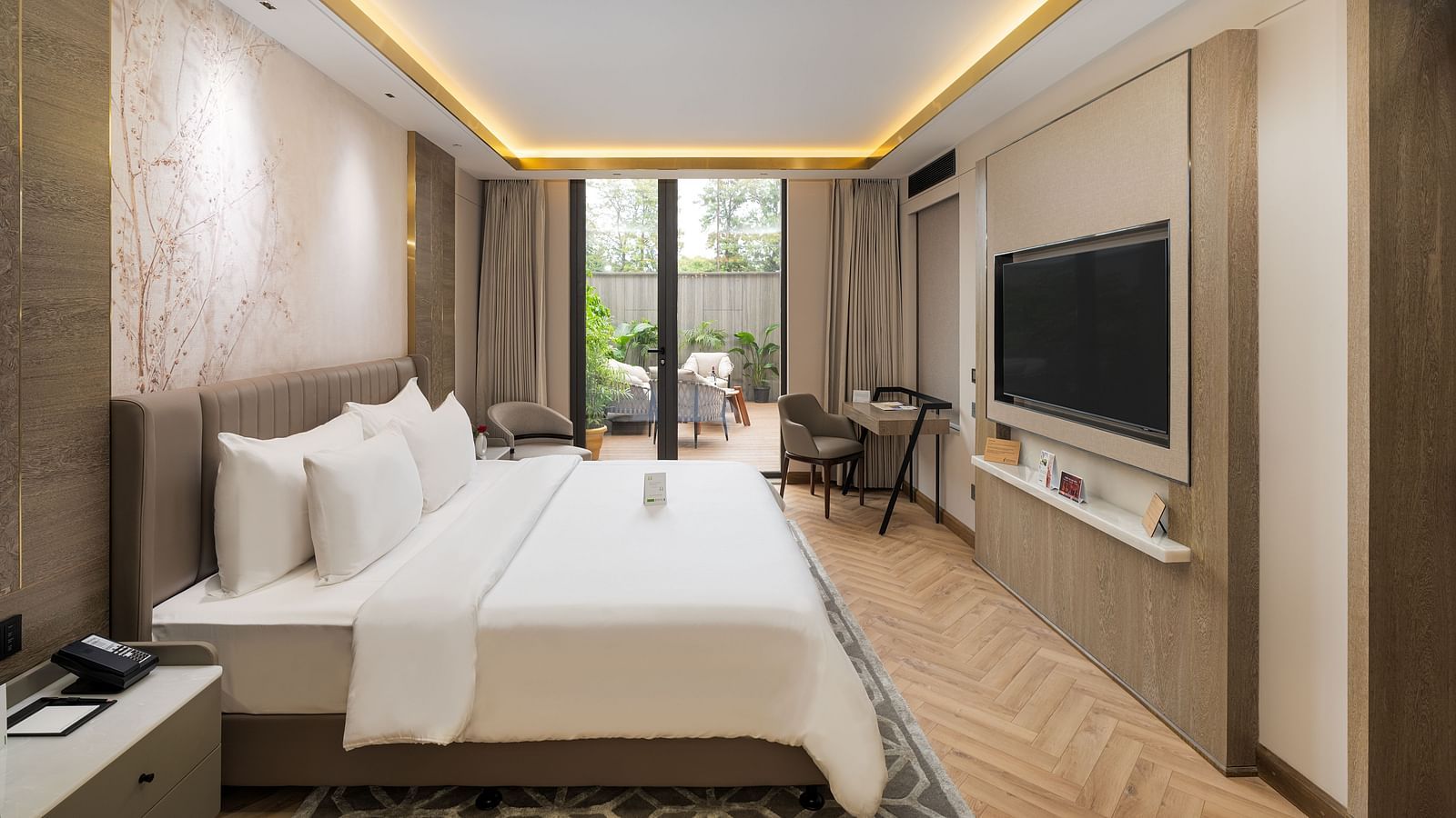 Comfortable Nirvana Suite bedroom furnished with two queen-size beds, tasteful decor, and ample natural light - Nirvana Luxury Hotel, Ludhiana