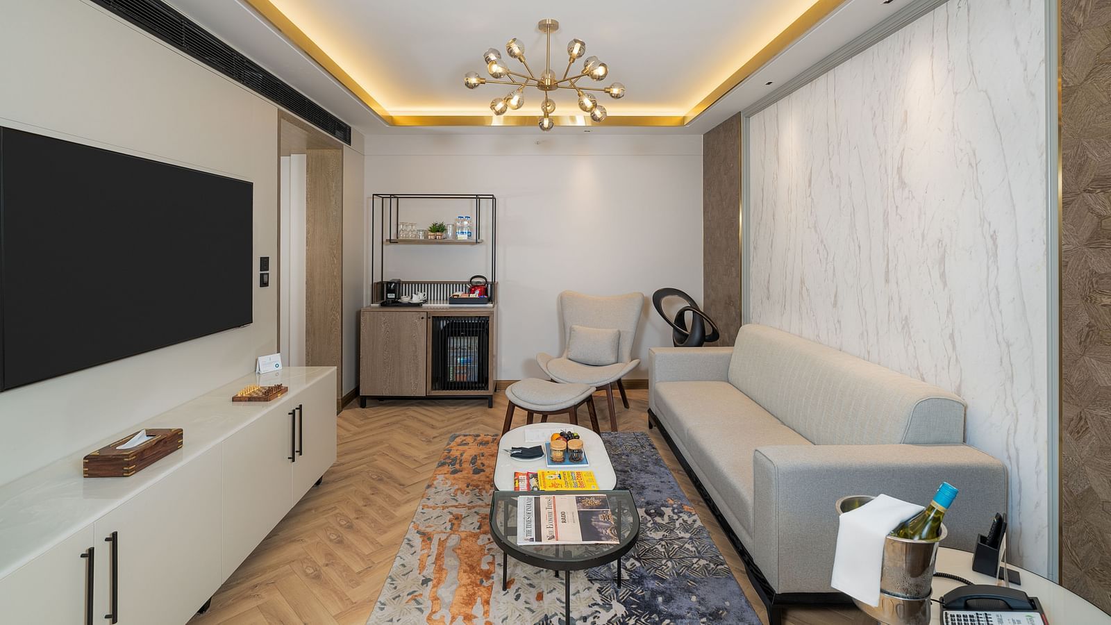 Well-appointed Nirvana Suite offering a dedicated workspace, a cosy seating area, and a convenient kitchenette  - Nirvana Luxury Hotel, Ludhiana