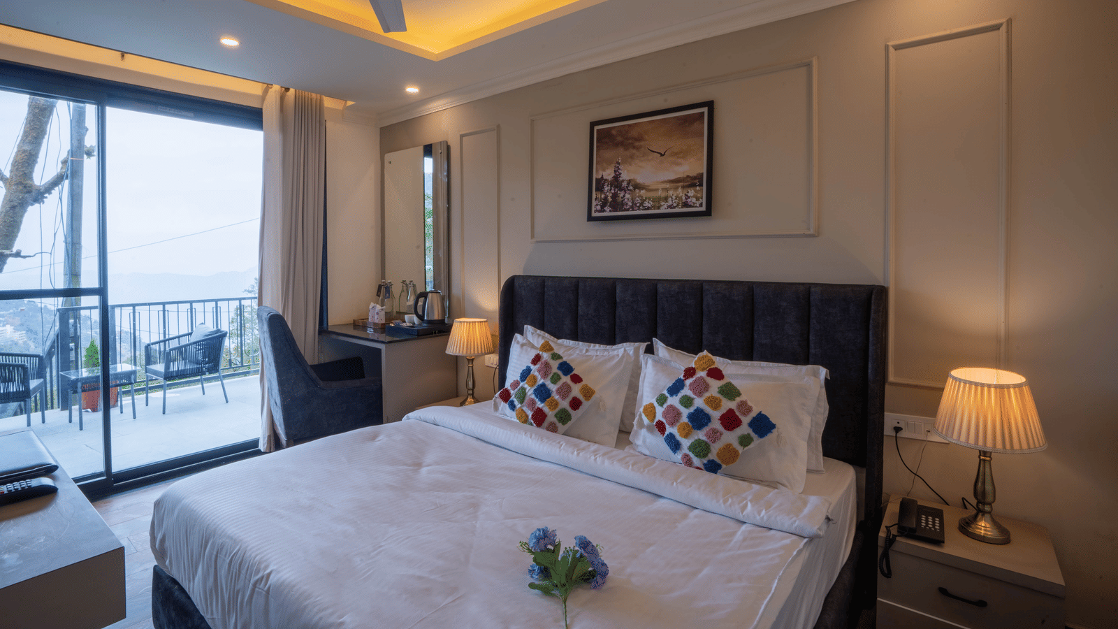 Corner view of the Deluxe Room With Shared Balcony & Valley View featuring a double bed along with huge french windows opening to the common balcony at Perfectstayz Premium Westend Mall Road, Mussoorie.