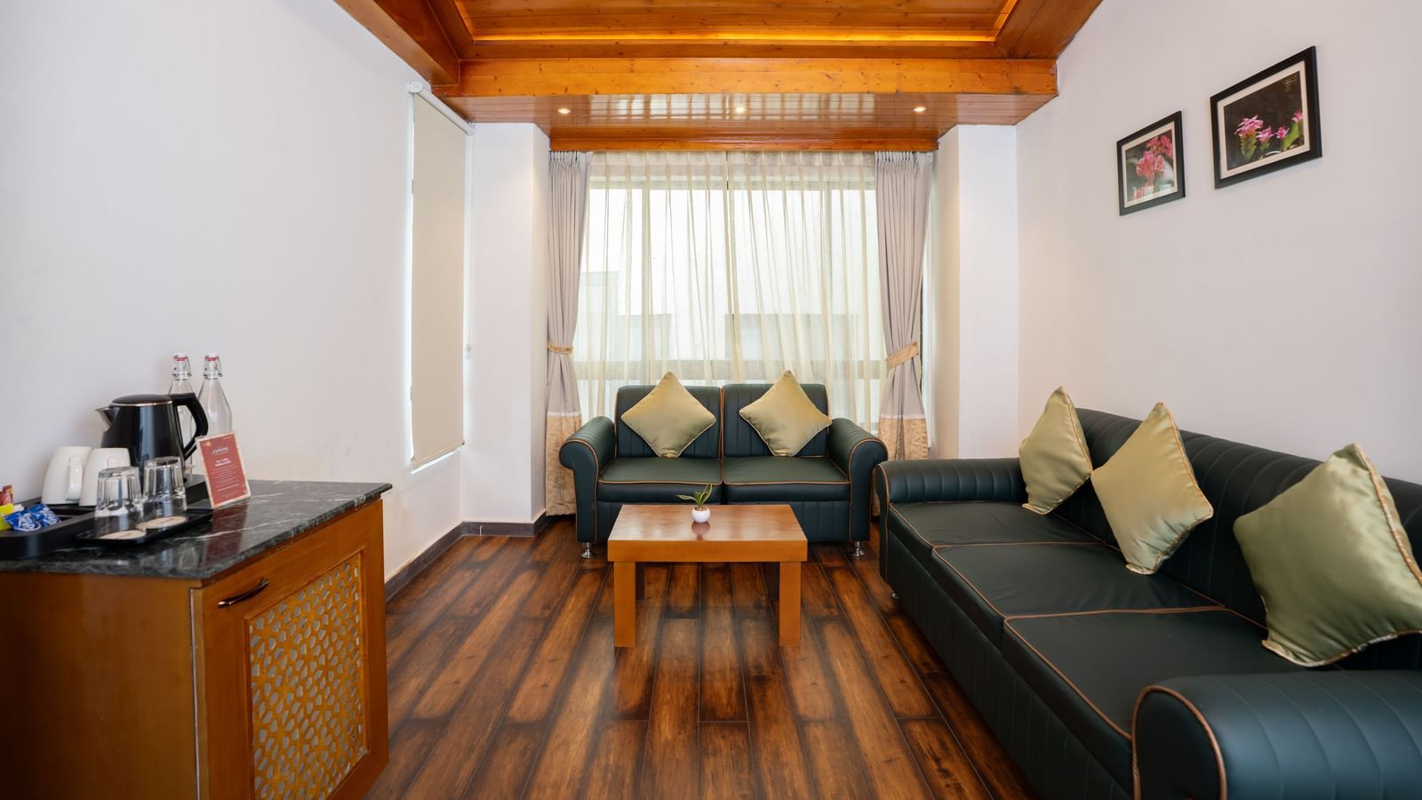 Suite at Summit North Star, Gangtok featuring sofa set, centre table, and a cabinet table with tea and coffee maker.