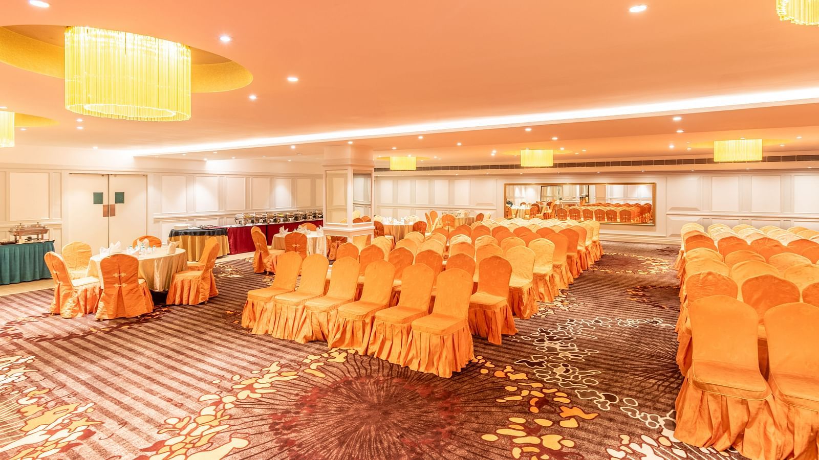 Spacious hall set up in classroom-style seating, ideal for training sessions or workshops