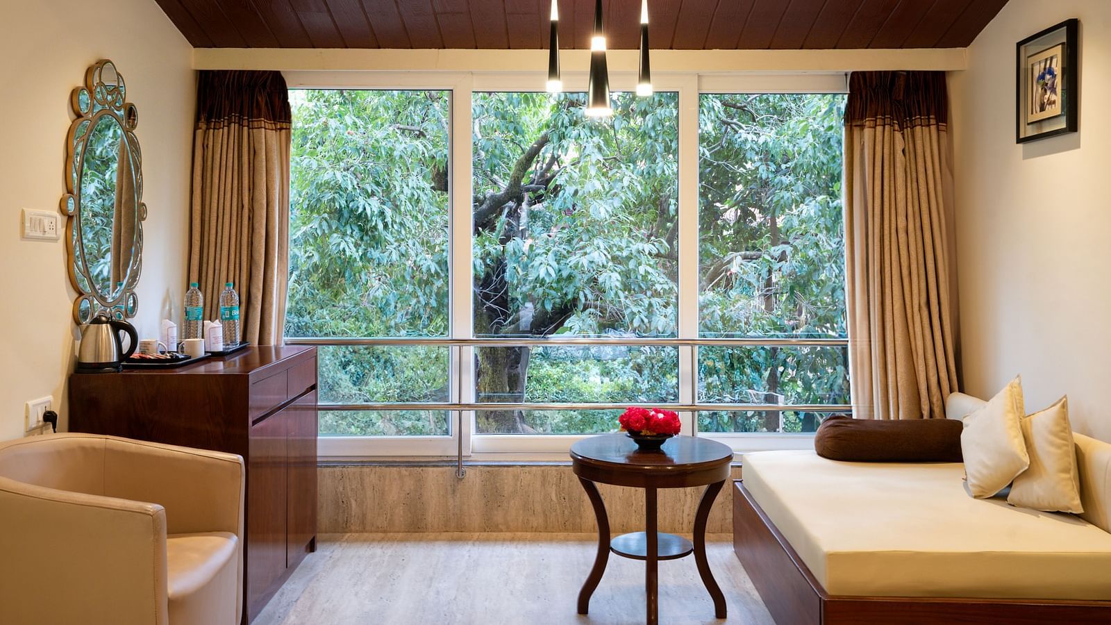 Image of the separate seating arrangement inside the grand classic room of the resort | The Grand Legacy Resort and Spa 