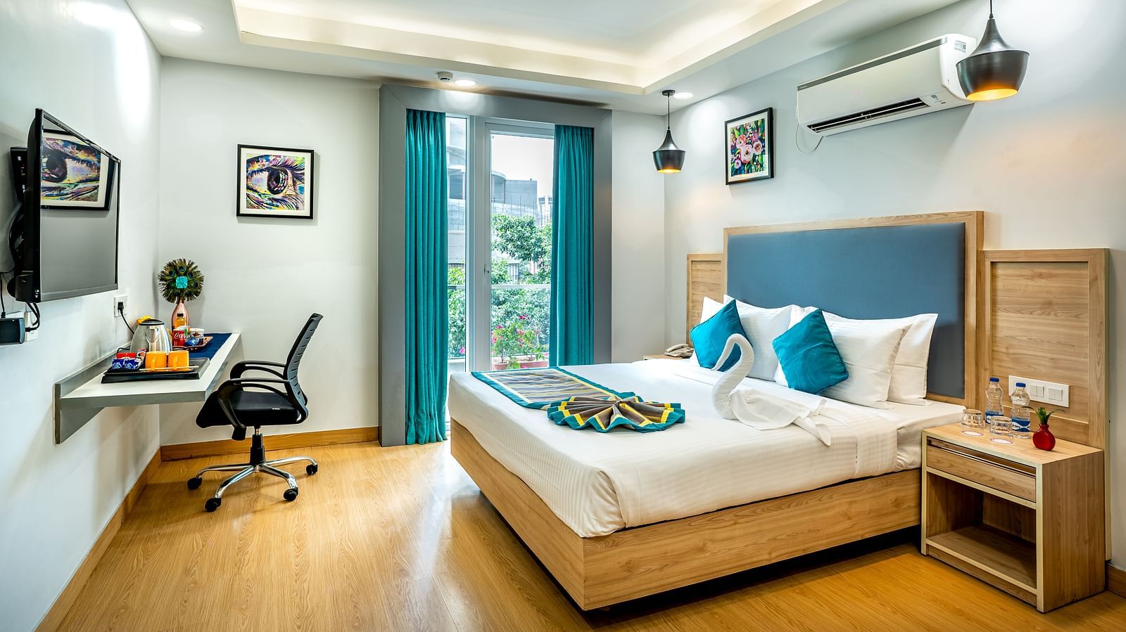 An image of a bedroom with attached balcony | Inde Hotel Golf Course Extension