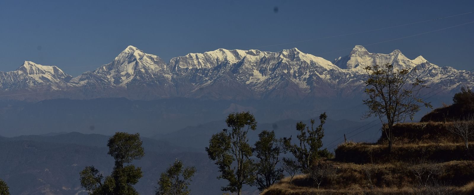 A farm at our resort in Almora with snow-capped Himalayas in the background - BluSalzz Escapade - Anant Rasa Resort