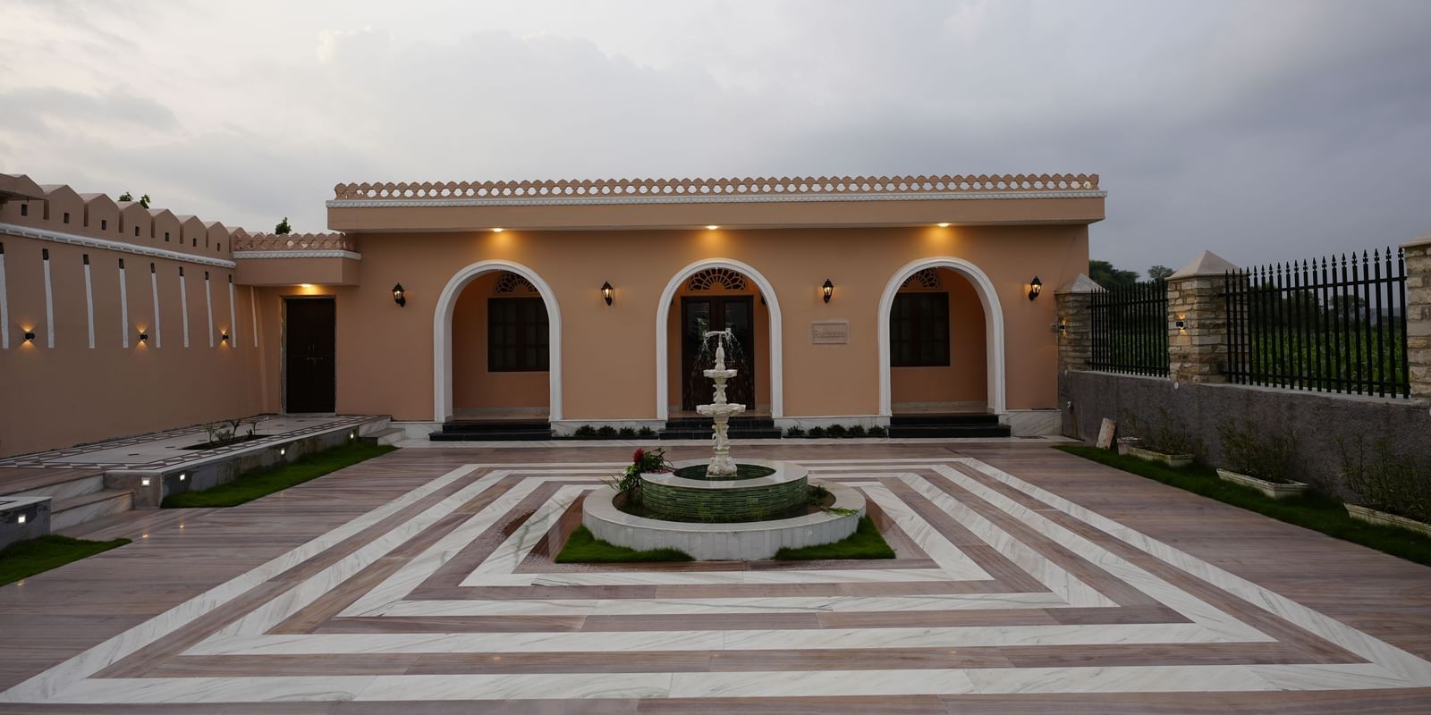 An eye-level, straight-on shot of the entrance to a building with a large courtyard at Mahendra Niwas.