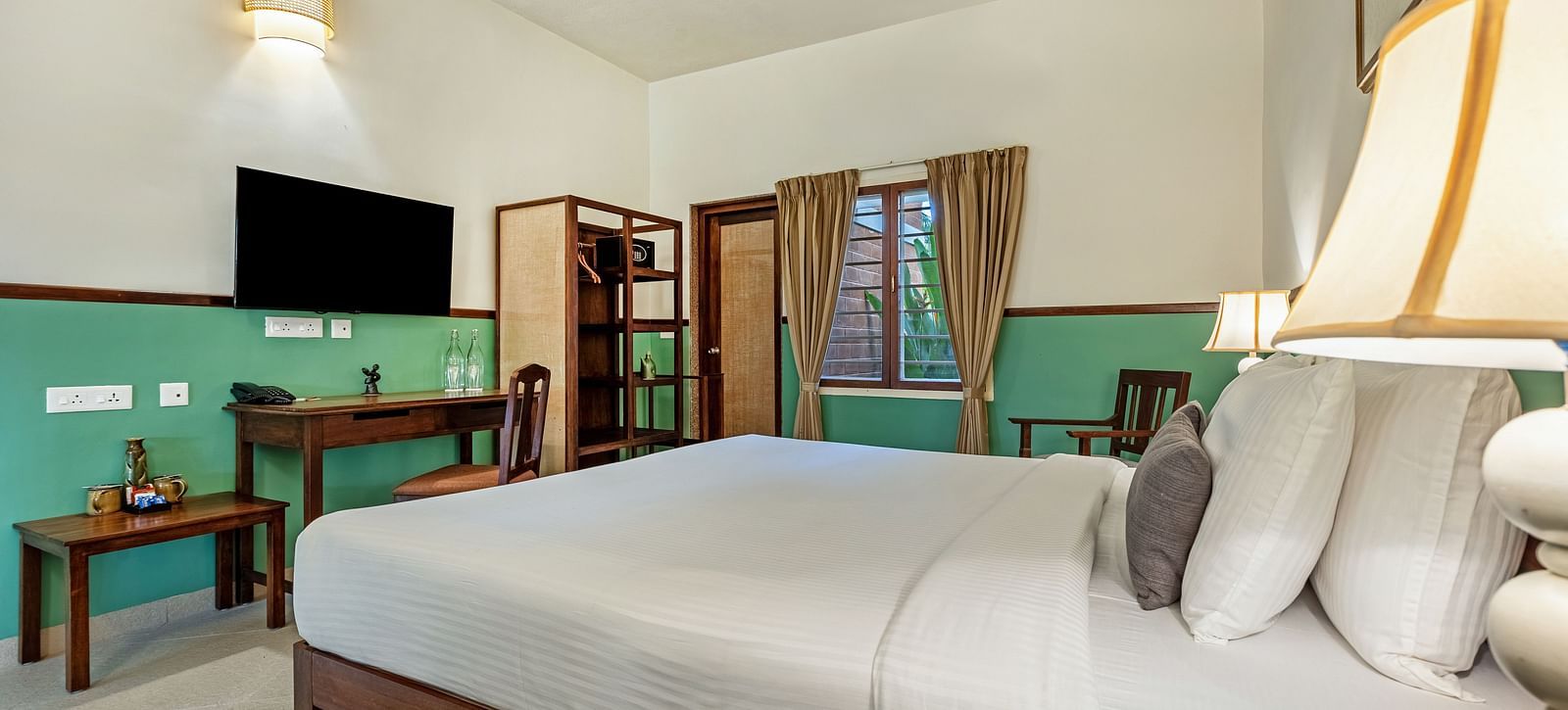 Spacious and modern hotel room near Pondicherry with a king size bed and work desk | Mango Hill Shallow Beach Resort ECR.