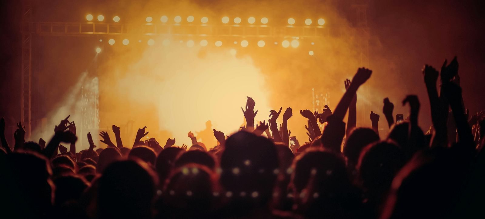 A crowd of people cheering in a concert |  Mango Hill Central, Chennai