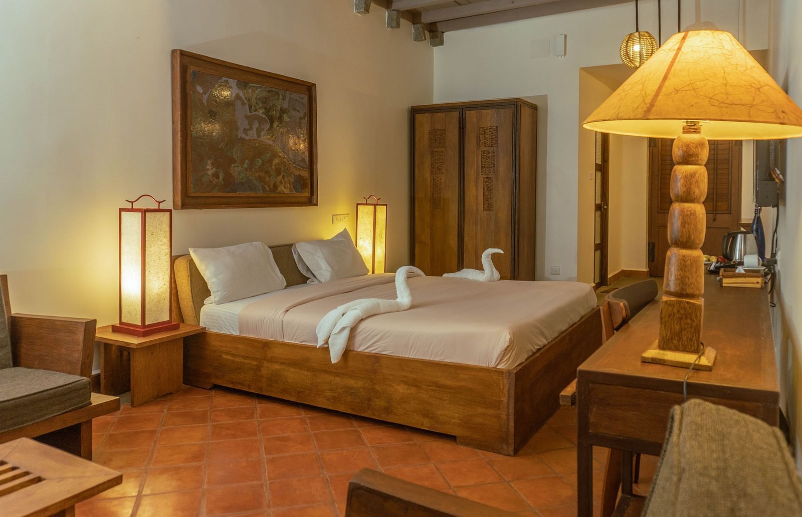 Cosy, artistic bedroom with traditional wooden furniture  | Mango Hill, Yercaud