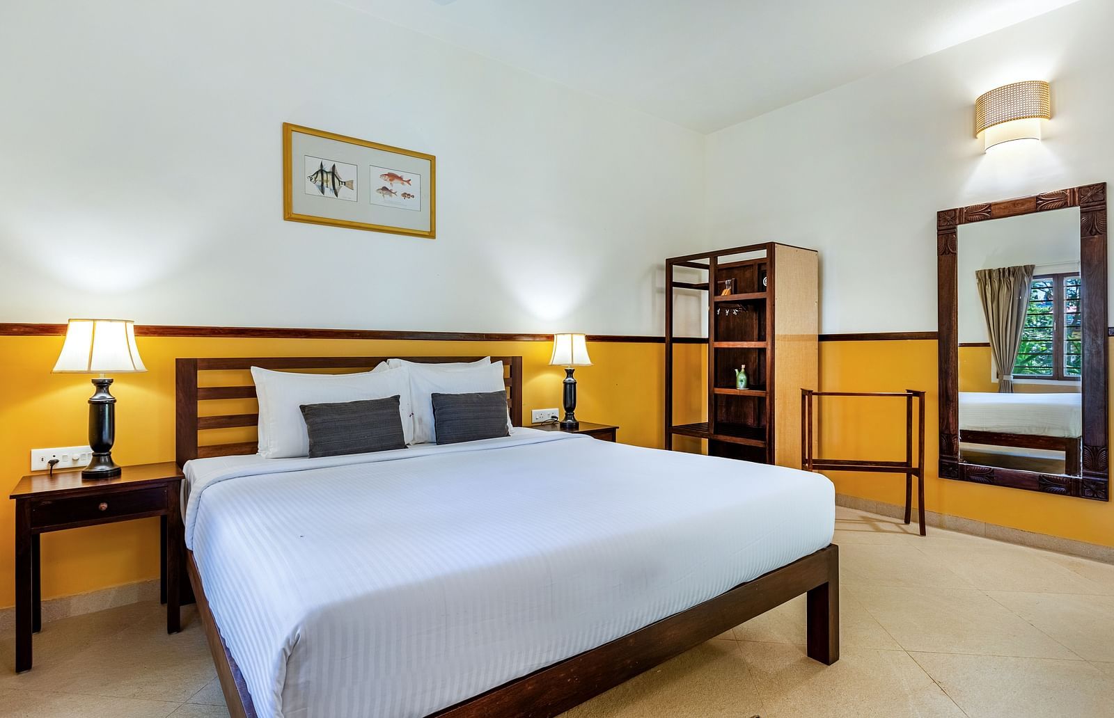  Bedroom with a double bed, nightstands, lamps, a mirror, and a shelving unit | Mango Hill Shallow Beach Resort ECR