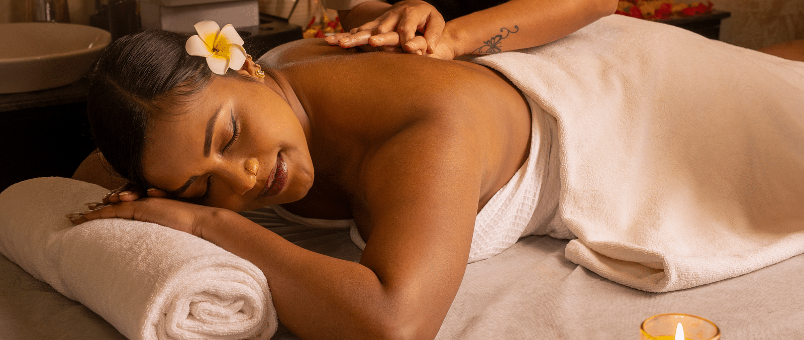 Image of a woman receiving back massages at Ayur Spa - Coral Reef Resort and Spa in Havelock