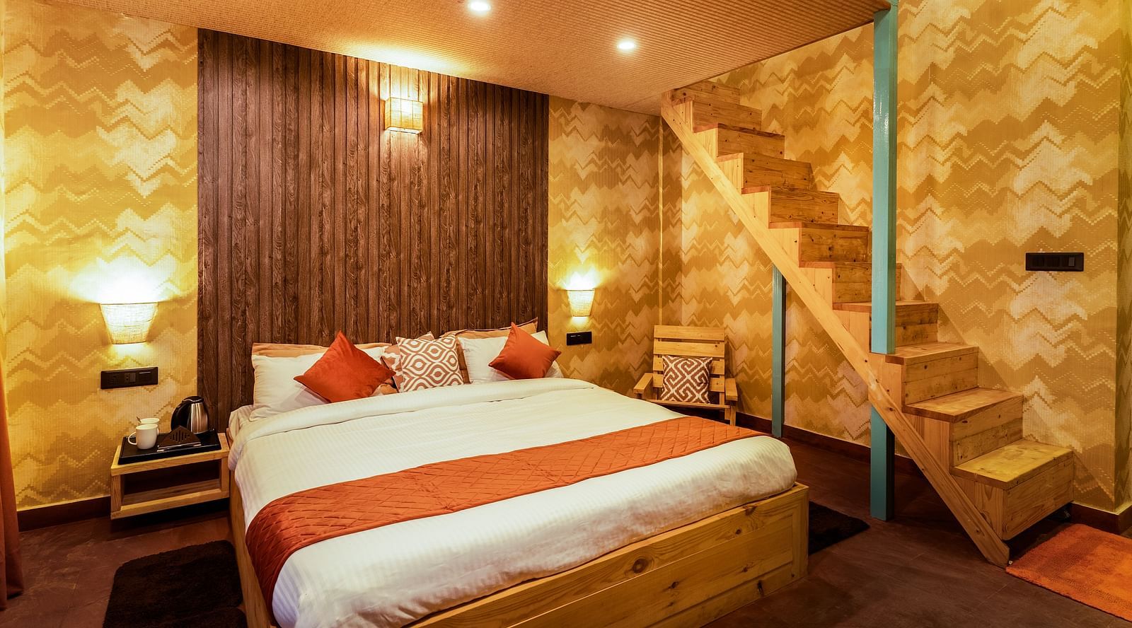A room with a double bed and attic
