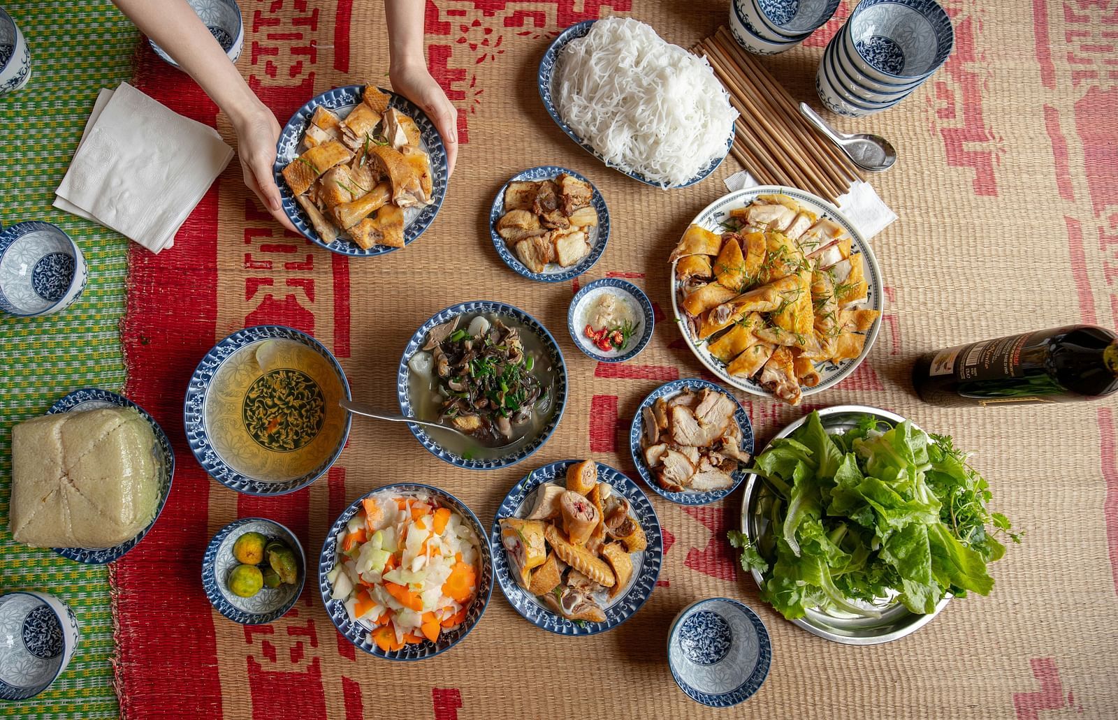 A top view of many items kept on the floor to be consumed with different sauces in view as well.