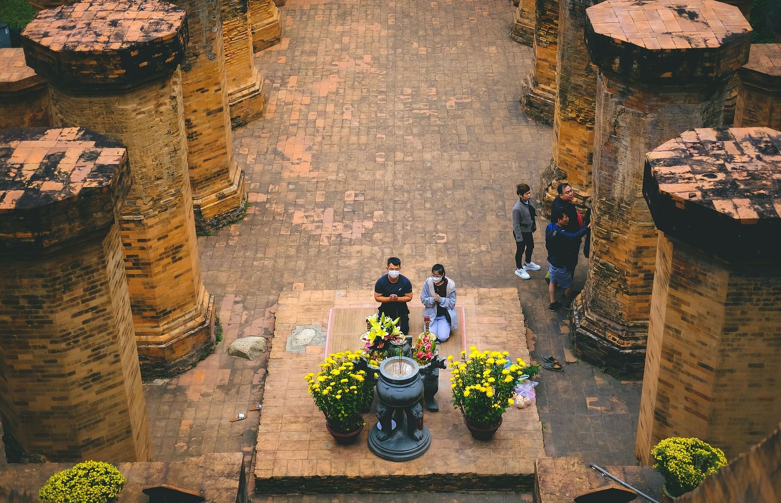 A top-angle view of people praying in a temple in Nha Trang.