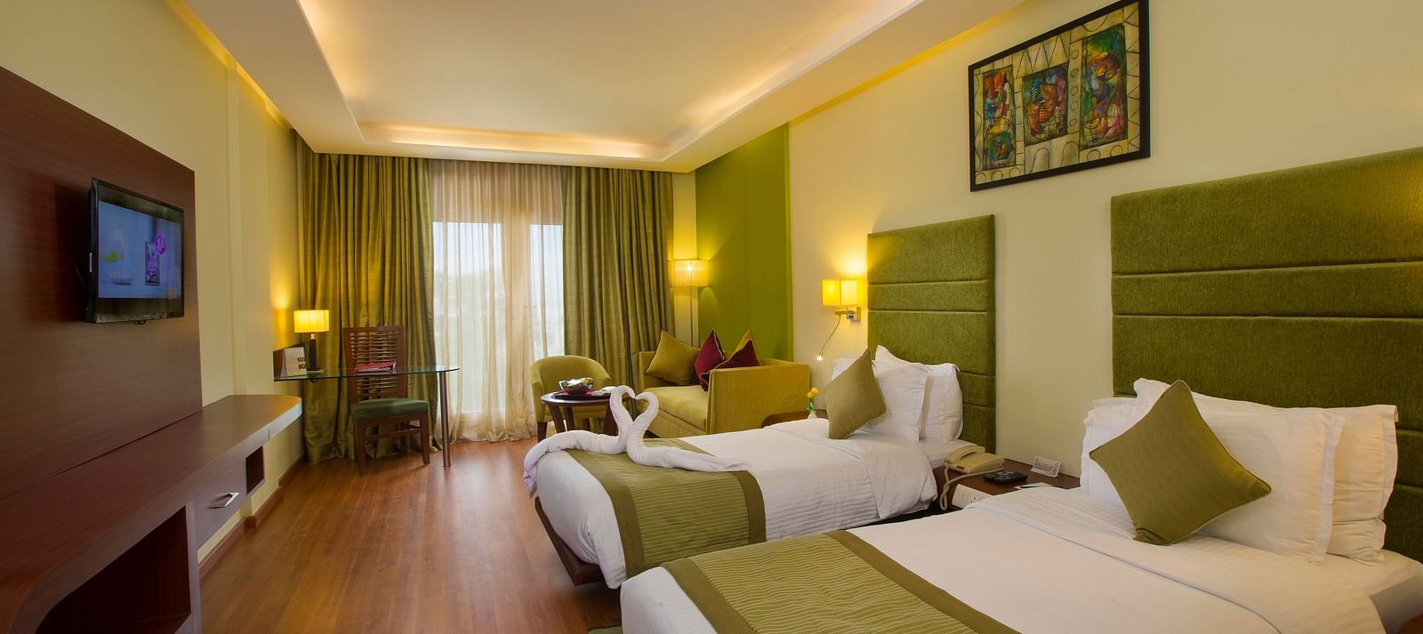 twin beds placed in Superior Room at Hotel Atithi - TGI Grand, Pondicherry