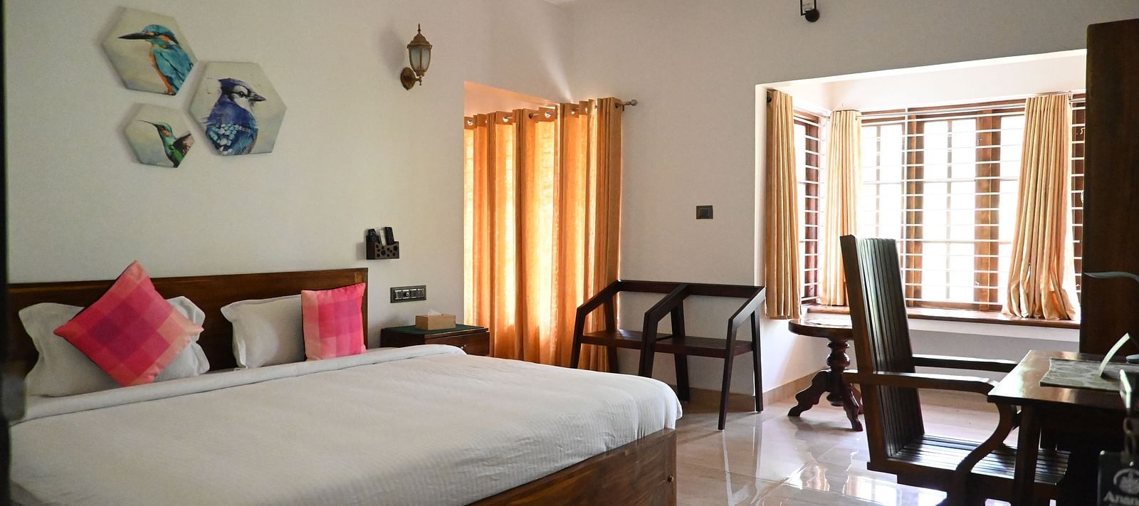 Image of a double bed in the 101 Non ac Room at Ananda Holiday Home, Wayanad 1