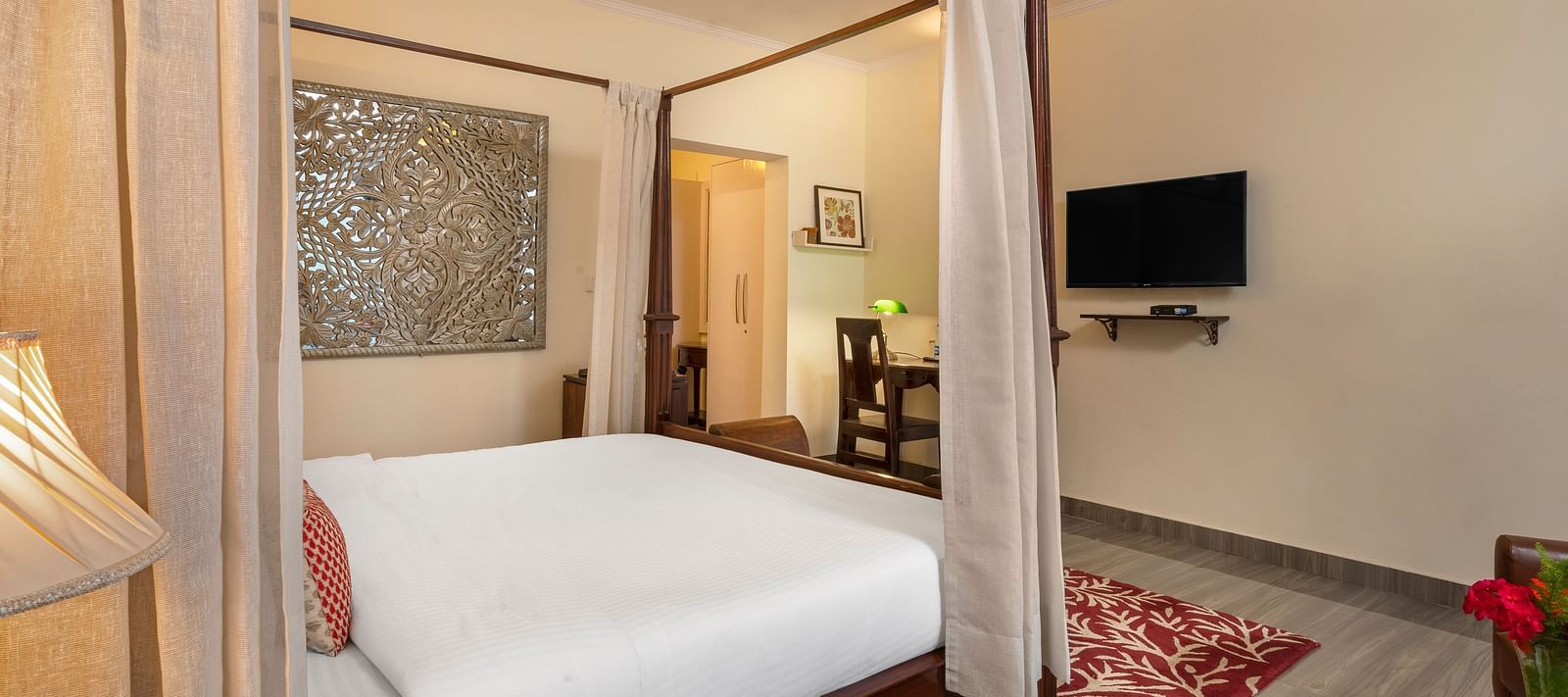 Comfortable suite with elegant furnishings, canopy bed, and flat-screen TV, at BluSalzz Collection - Suvaasa Resort, Ramgarh.