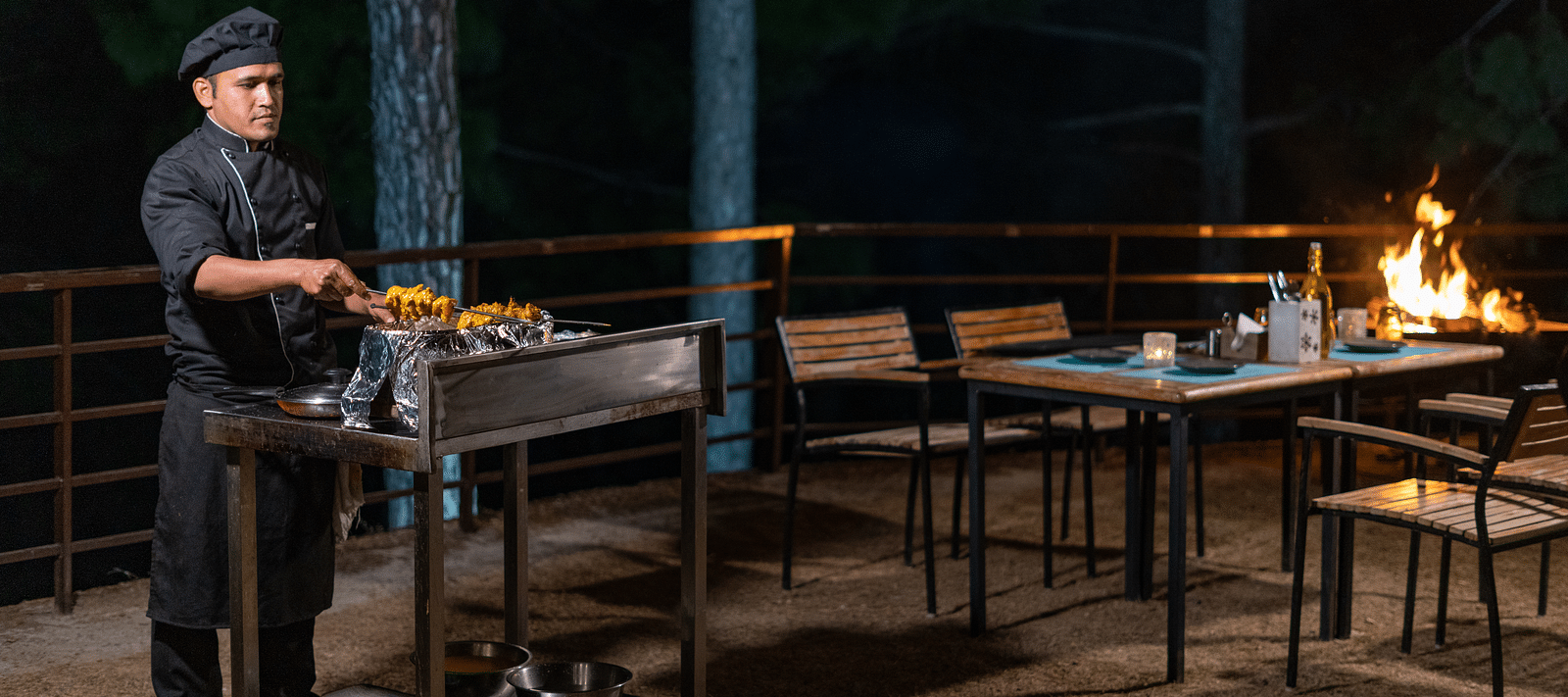 Chef performing a live barbecue session in the garden at BluSalzz Escapade Resort, Lansdowne.