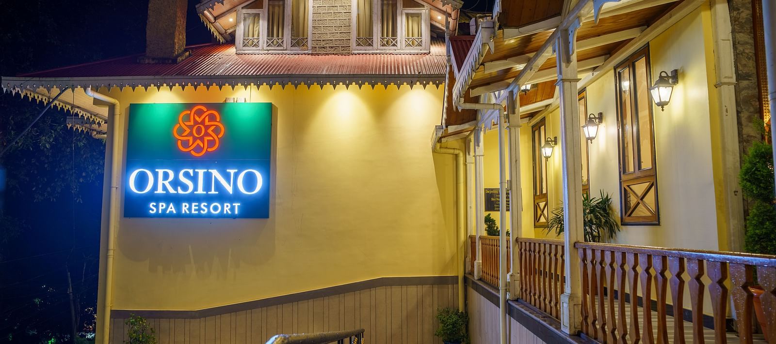The exterior of Orsino Spa Resort with warm lighting and visible architectural details.