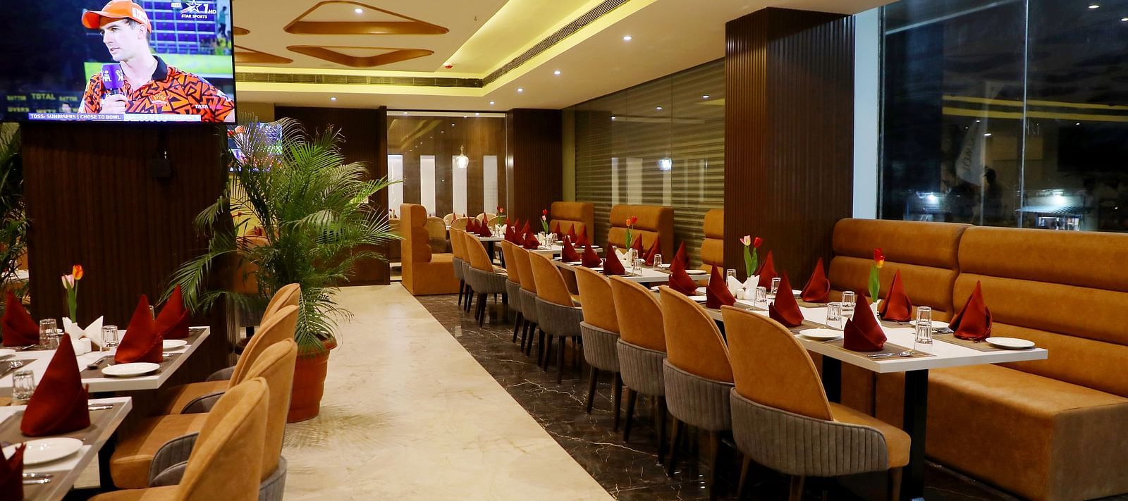 Spacious restaurant at Town Square Suites with modern interiors and ample seating arrangement