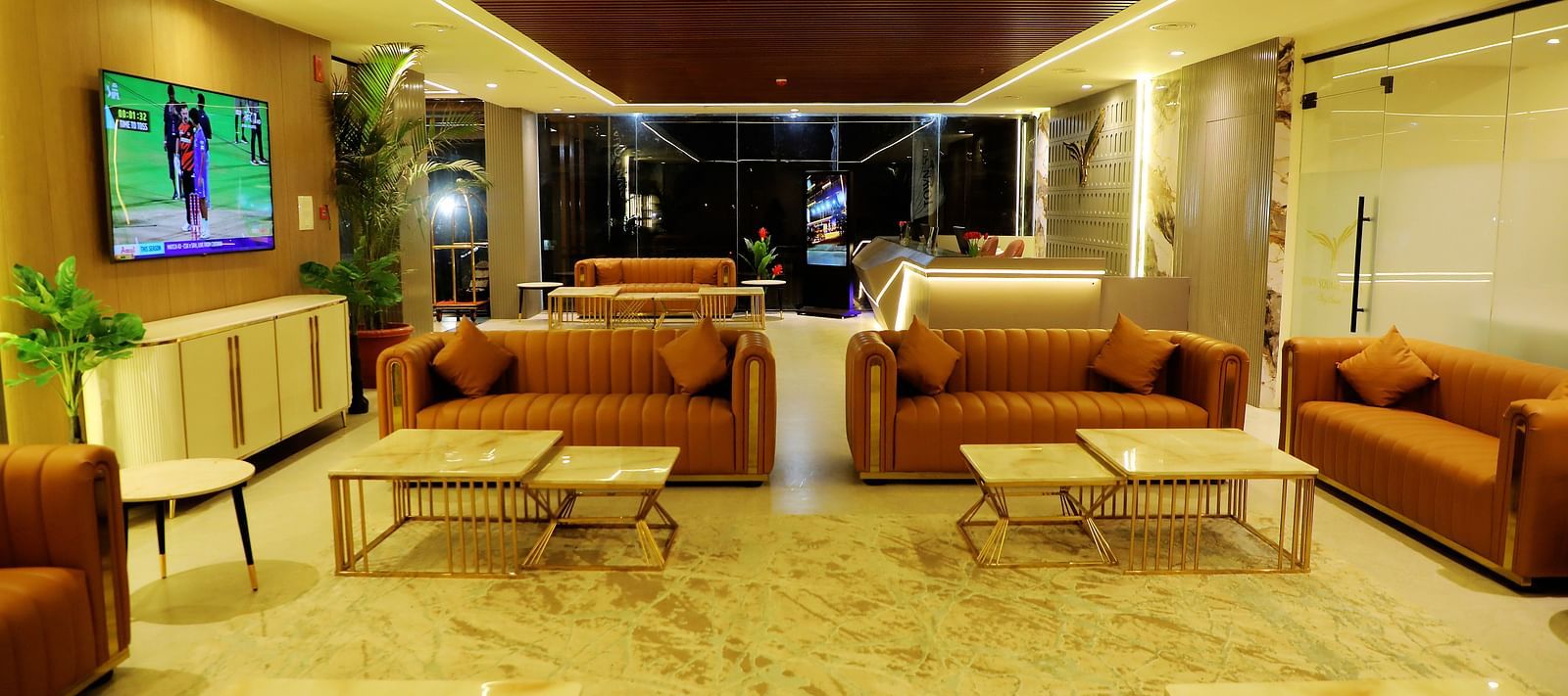 Chic lobby lounge at Town Square Suites with plush seating and a sophisticated ambiance