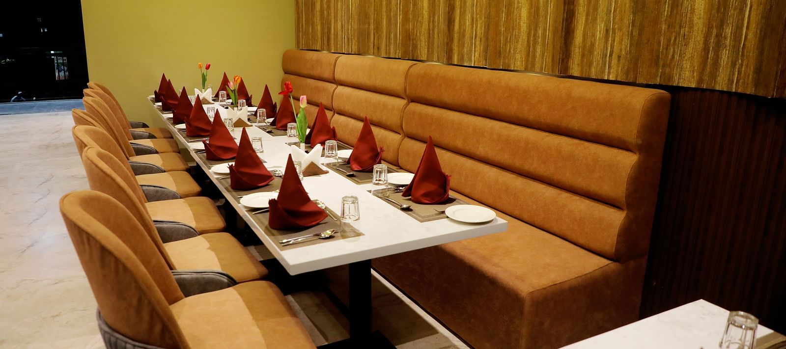 Private dining booths at Town Square Suites restaurant with intimate seating and elegant decor