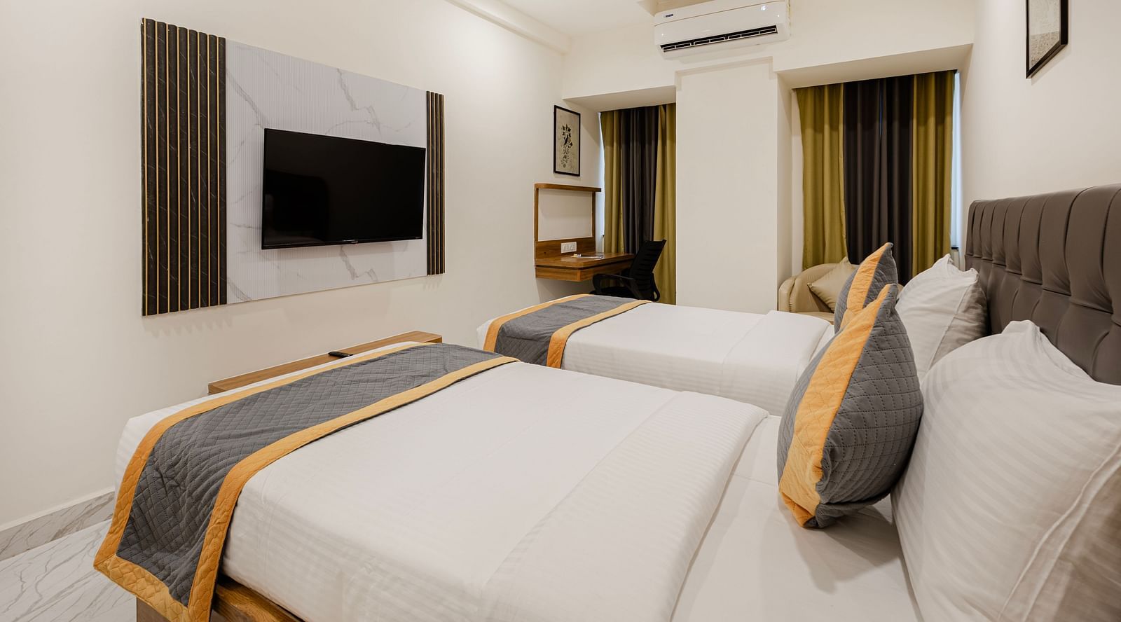 Bright twin bedroom with light and contemporary design at Lemonridge Hotels, IDPL Balanagar